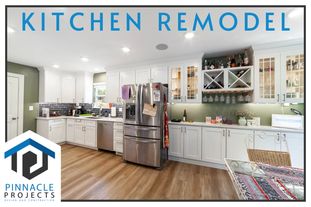 White kitchen with stainless steel appliances and the text Kitchen Remodel, Pinnacle Projects Design and Construction