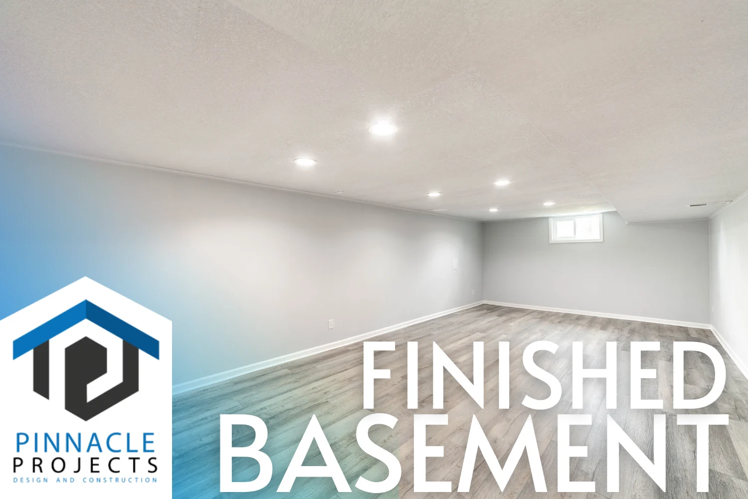Empty room with gray walls, wood-look flooring and recessed lights; text “FINISHED BASEMENT” and “PINNACLE PROJECTS”